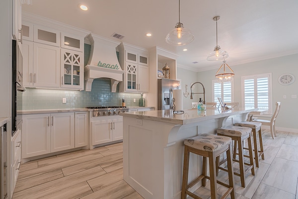 Fully equipped gourmet kitchen with modern appliances, dishwasher, and all cookware needed for group meals.