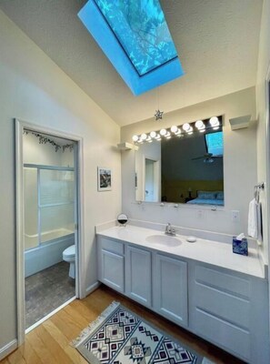 Bathtub, hair dryer, towels, soap