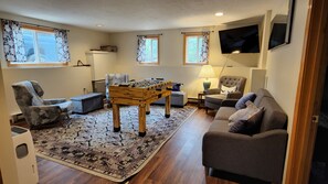 Smart TV, fireplace, table football, books