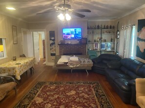 Smart TV, fireplace, table football, books
