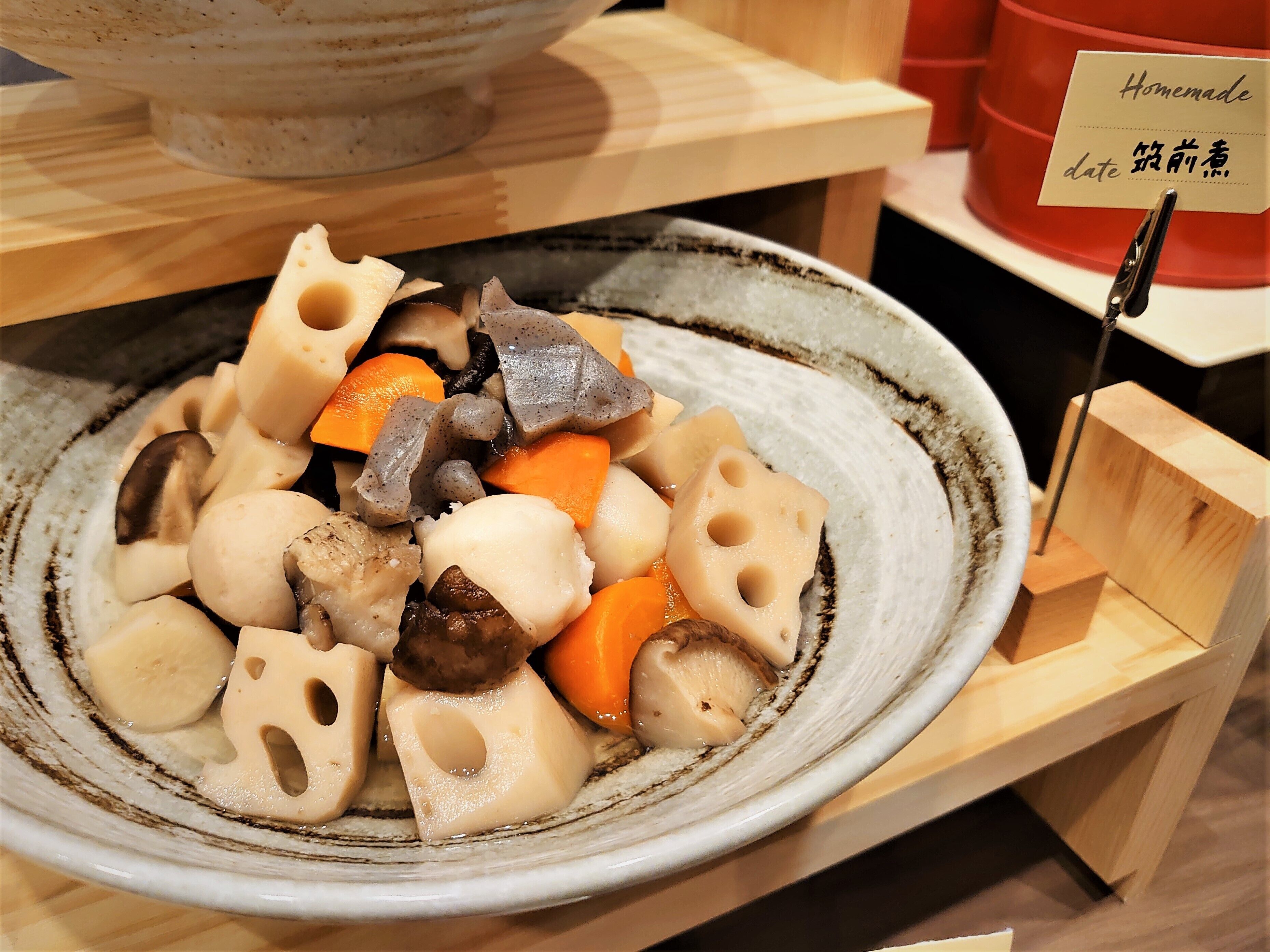 A ceramic plate with a variety of vegetables and mushrooms.