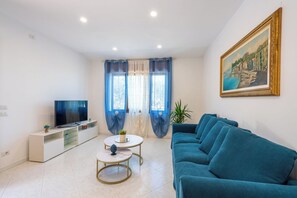 Family Villa | Living area | Flat-screen TV