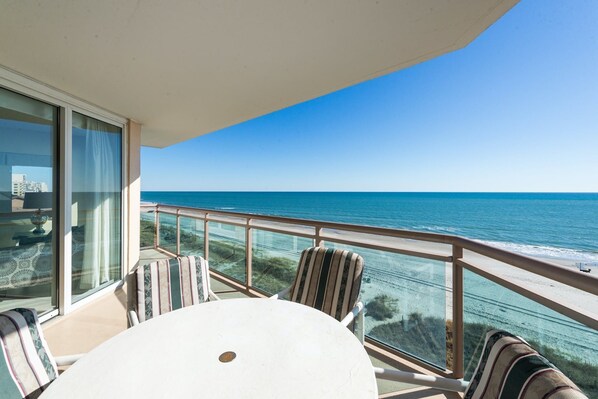 Outdoor dining - Oceanfront 3-bedroom condo with a glass-paneled balcony | Bahama Sands - 602 (North Myrtle)