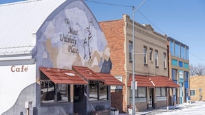 A building with a mural of mountains and the text "The Most Unlikely Place."