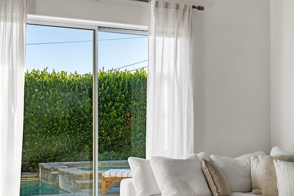 Cozy lounge space with views of the private pool for easy relaxation from sunrise to sunset