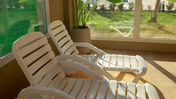 Indoor pool, seasonal outdoor pool, pool umbrellas, pool loungers