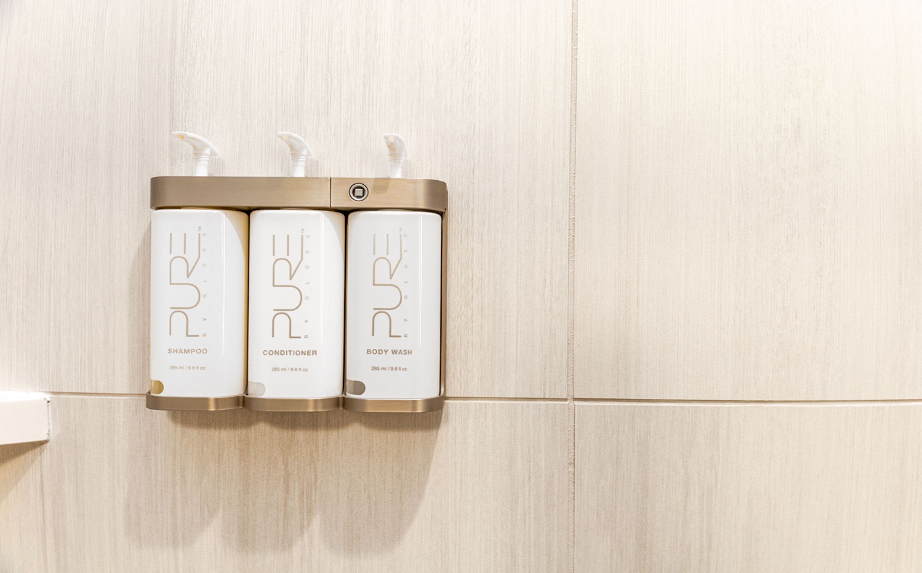 shower, designer toiletries, hair dryer, towels