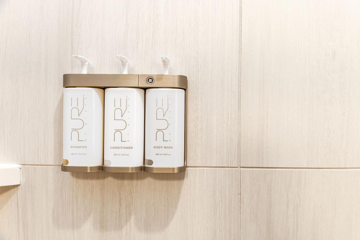 shower, designer toiletries, hair dryer, towels