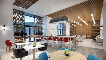 Un comedor moderno con techos altos, ventanas amplias y diversas opciones de asientos, incluidas mesas y sillas.