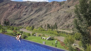 Outdoor pool, open 9:00 AM to 6:00 PM, pool umbrellas, sun loungers