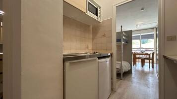 Fridge, microwave, stovetop, coffee/tea maker