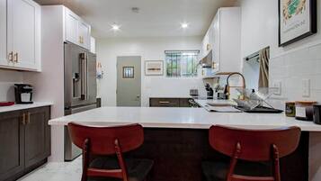 Coffee/tea maker, fridge, microwave, oven
