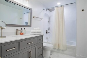 Bathtub, hair dryer, towels