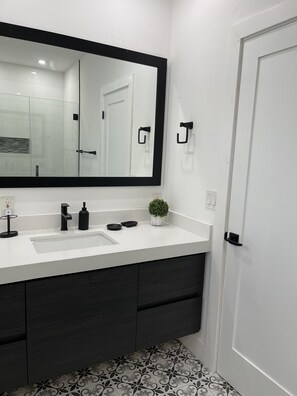 Shower, hair dryer, towels, toilet paper
