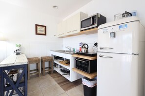 Microwave, coffee/tea maker, toaster, cookware/dishes/utensils