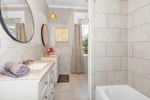 Combined shower/tub, towels, soap, toilet paper