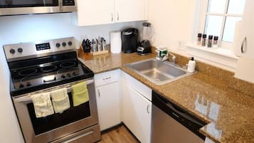 Fridge, microwave, coffee/tea maker, cookware/dishes/utensils