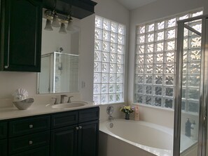 Combined shower/tub, hair dryer, towels, soap