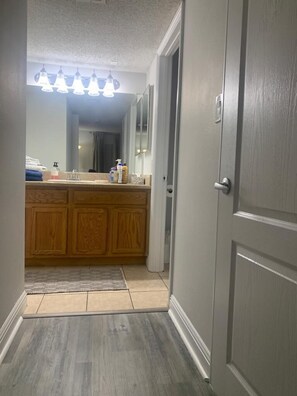 Combined shower/tub, hair dryer, towels, soap