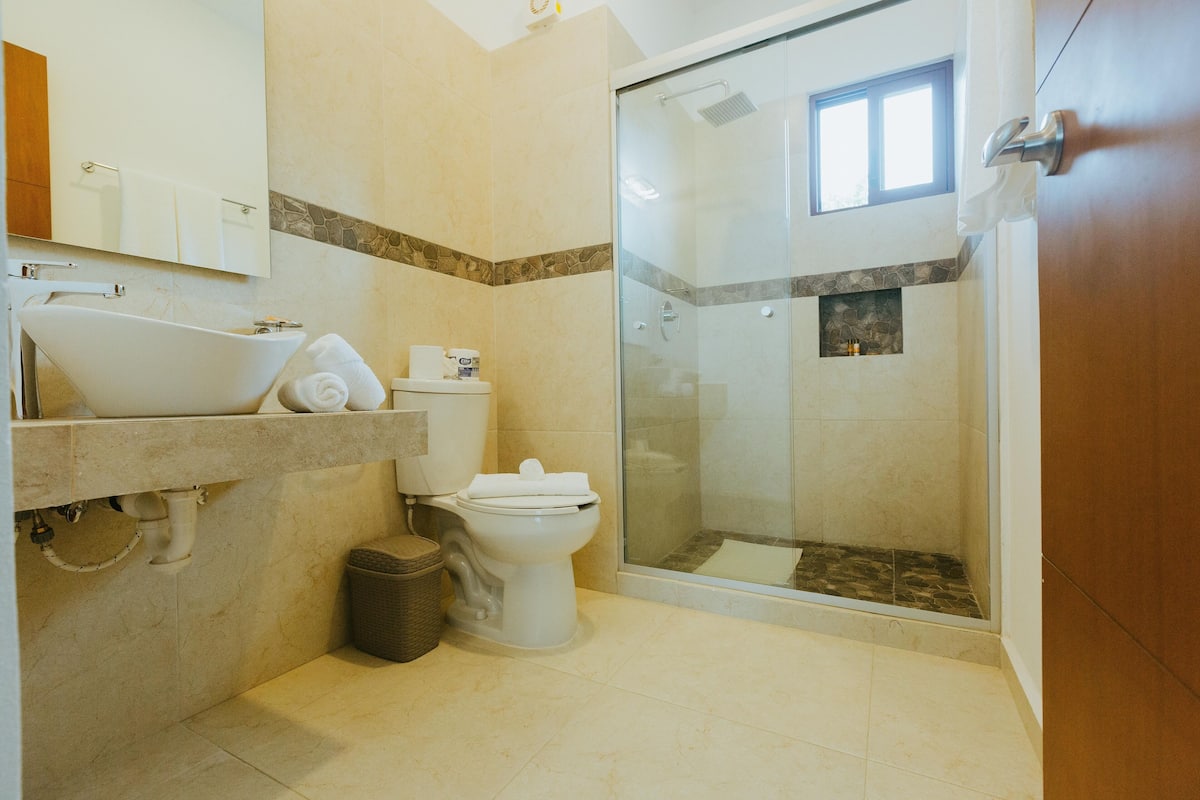 shower, rainfall showerhead, hair dryer, towels