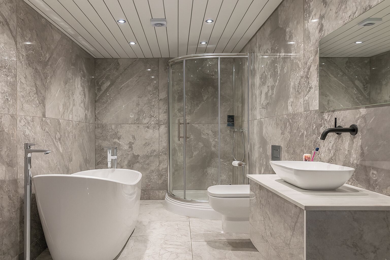 Separate bathtub and shower, deep-soaking bathtub, hair dryer, towels