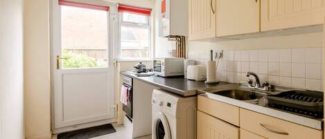 Apartment, 1 Queen Bed with Sofa bed | Private kitchen | Fridge, microwave, oven, stovetop