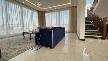 Presidential Villa, 4 Bedrooms | Living area | LED TV, toys