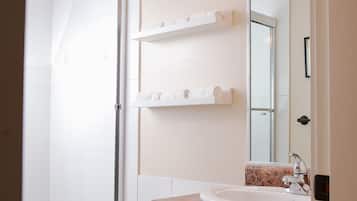 Combined shower/tub, hair dryer, towels, soap