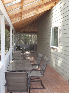 Relax in this inviting patio area with a glass-top table and comfortable seating for six.