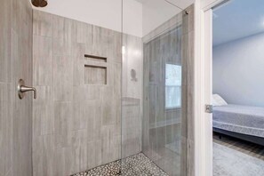 Combined shower/bathtub, hair dryer, towels, soap