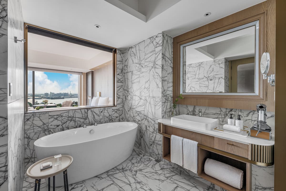 Separate tub and shower, rainfall showerhead, hair dryer, bathrobes