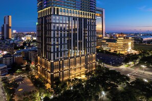 A high-rise building with a modern design, featuring a prominent entrance and multiple floors. - InterContinental Kaohsiung by IHG (Kaohsiung)