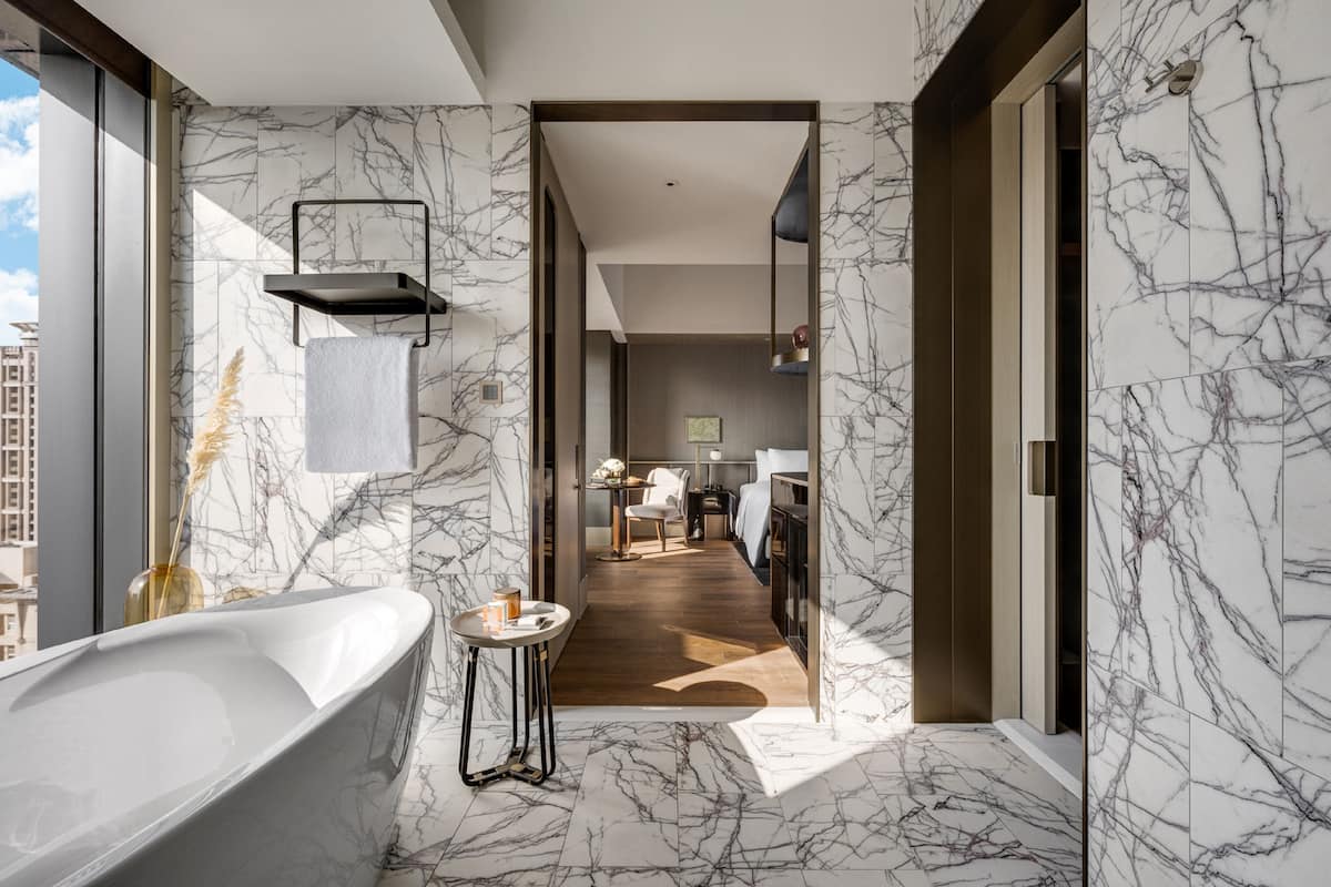 separate bathtub and shower, rainfall showerhead, hair dryer, bathrobes