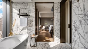 Separate tub and shower, rainfall showerhead, hair dryer, bathrobes