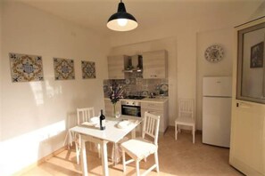 Appartement, 1 chambre, fumeurs, patio | Restauration