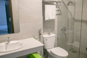 A bathroom with a sink, toilet, and shower. - Duong Chau Boutique Hotel (Tran Bien)