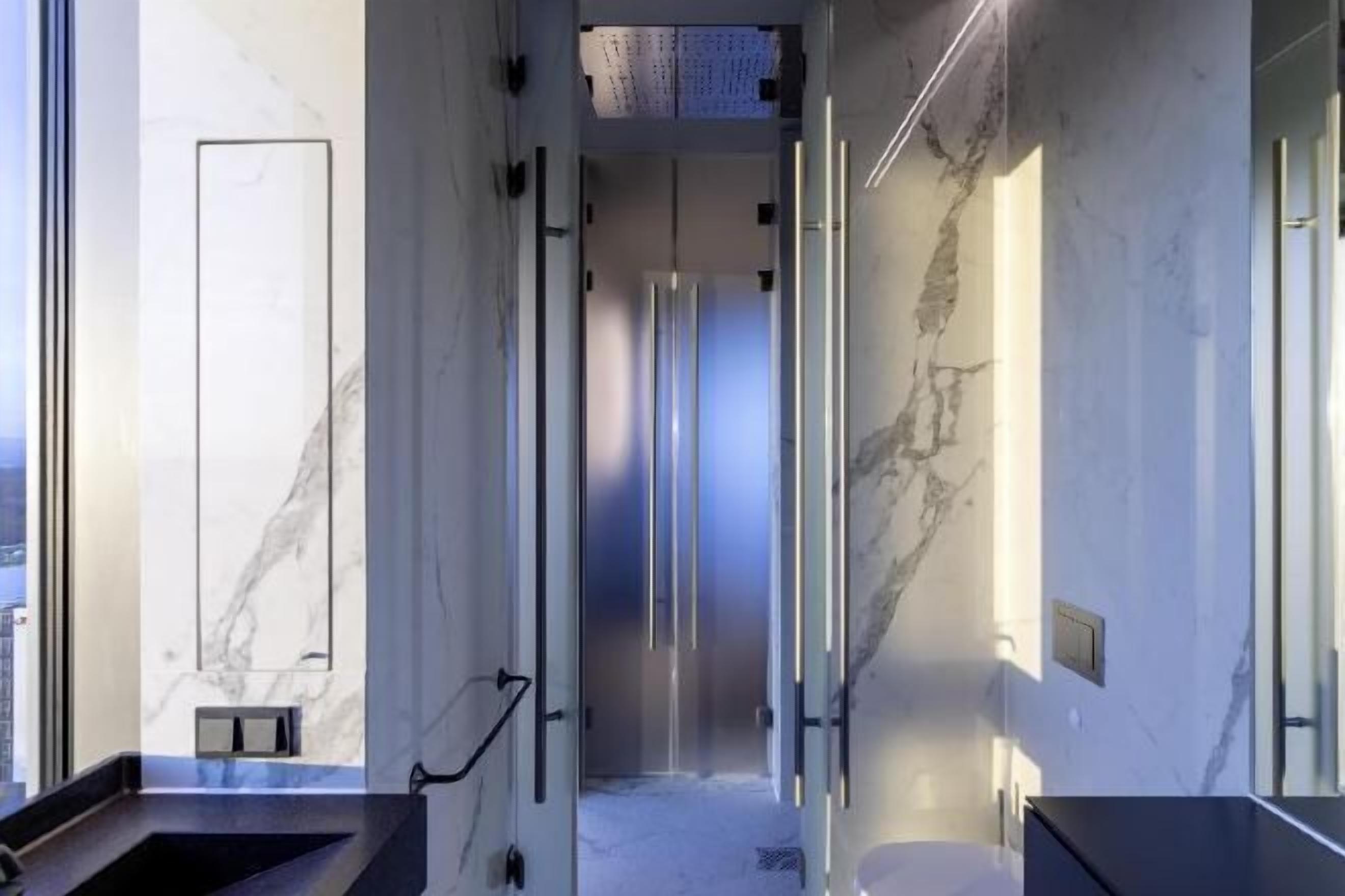 Bathroom | Shower, rainfall showerhead, hair dryer, towels