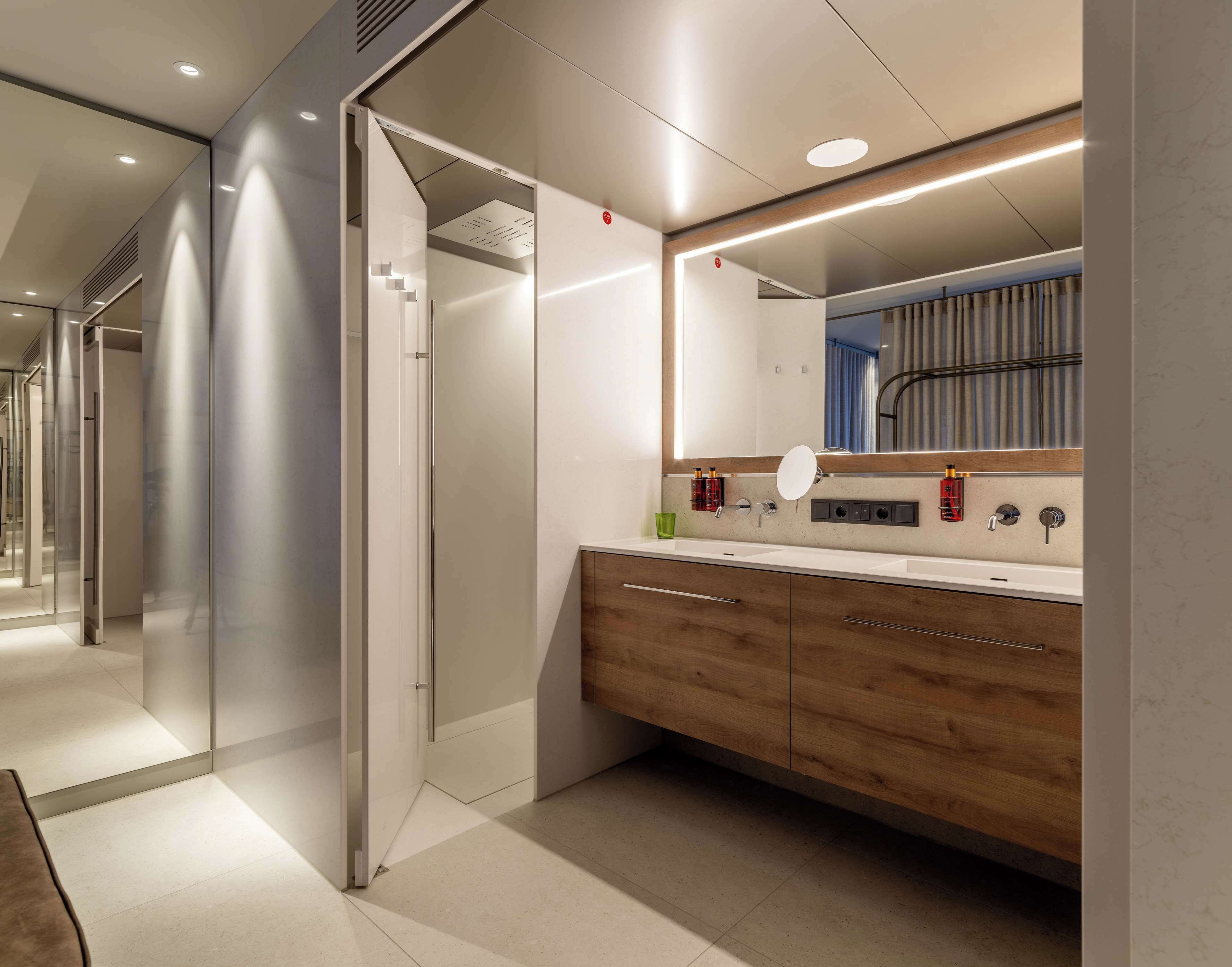 shower, rainfall showerhead, hair dryer, towels