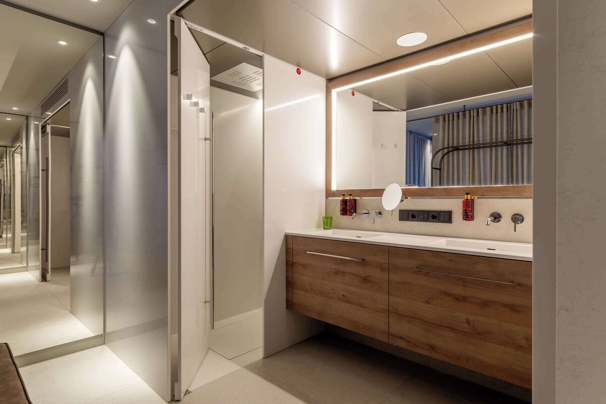 shower, rainfall showerhead, hair dryer, towels