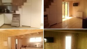 A multi-level wooden interior with a kitchen, dining area, and living space. - Studio in the pines (Lacanau)