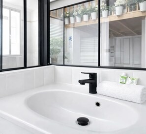 Shower, hair dryer, towels, soap