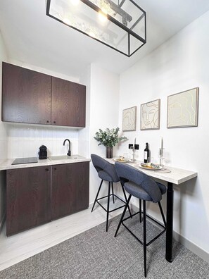 Fridge, microwave, stovetop, coffee/tea maker