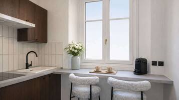 Fridge, microwave, stovetop, coffee/tea maker