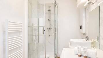 Shower, hair dryer, towels, soap