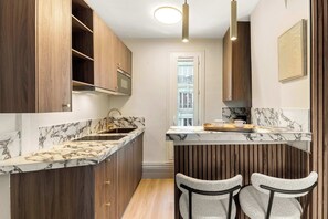 Fridge, microwave, stovetop, coffee/tea maker