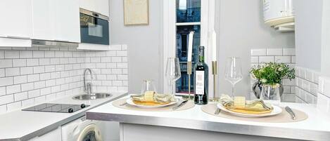 Fridge, microwave, stovetop, coffee/tea maker