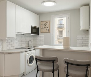 Fridge, microwave, stovetop, coffee/tea maker