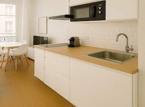 Fridge, microwave, stovetop, coffee/tea maker