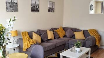 Apartment | Living room | 30-inch TV with cable channels
