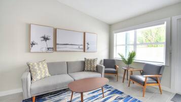 Living space with seating and full size sleeper sofa